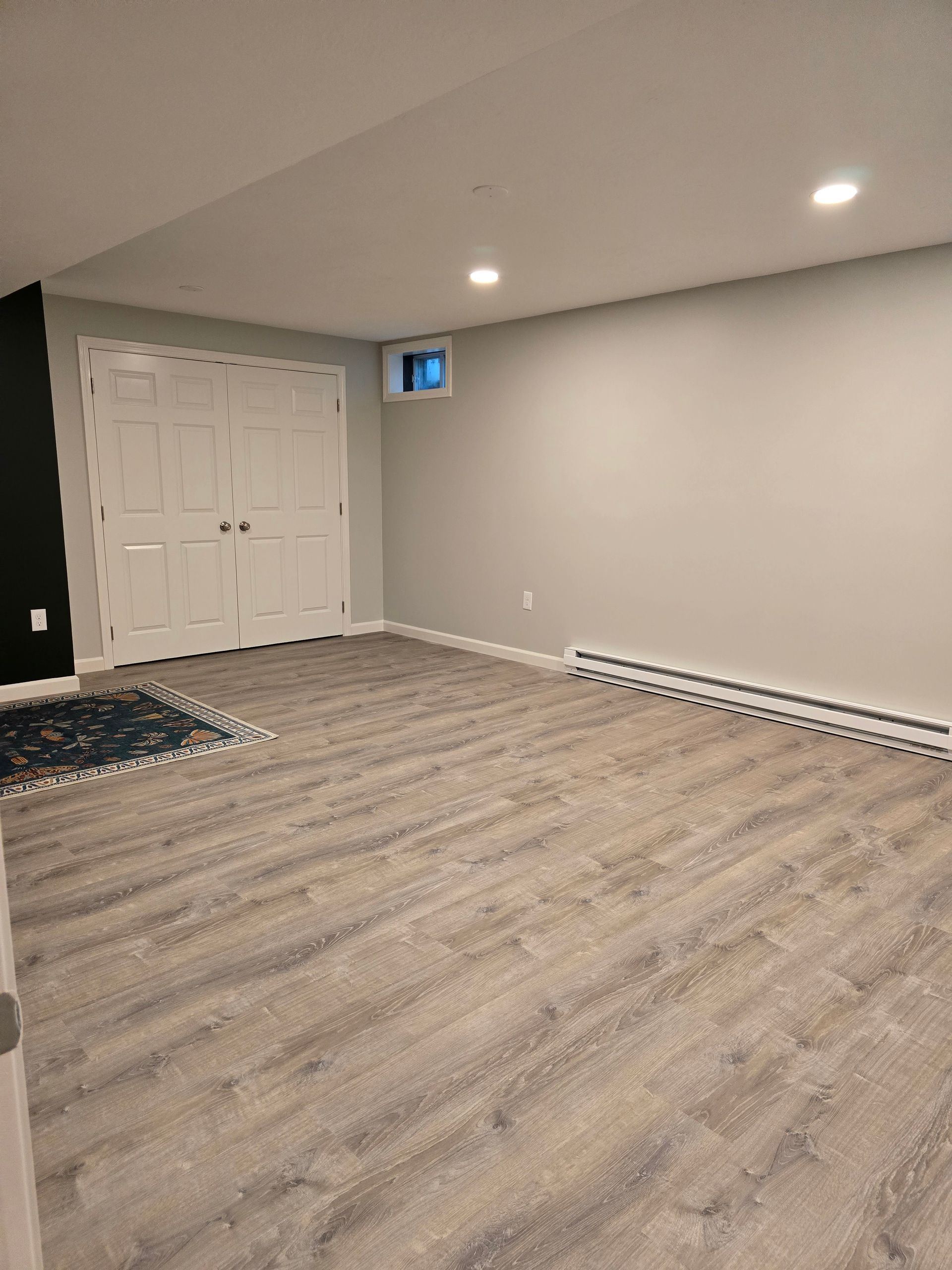 Basement Remodeling Project in Melrose, MA, by New England Painting and Contracting