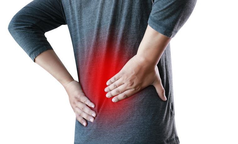 Person holding lower back with red pain highlight, illustrating lower back pain or injury concept.