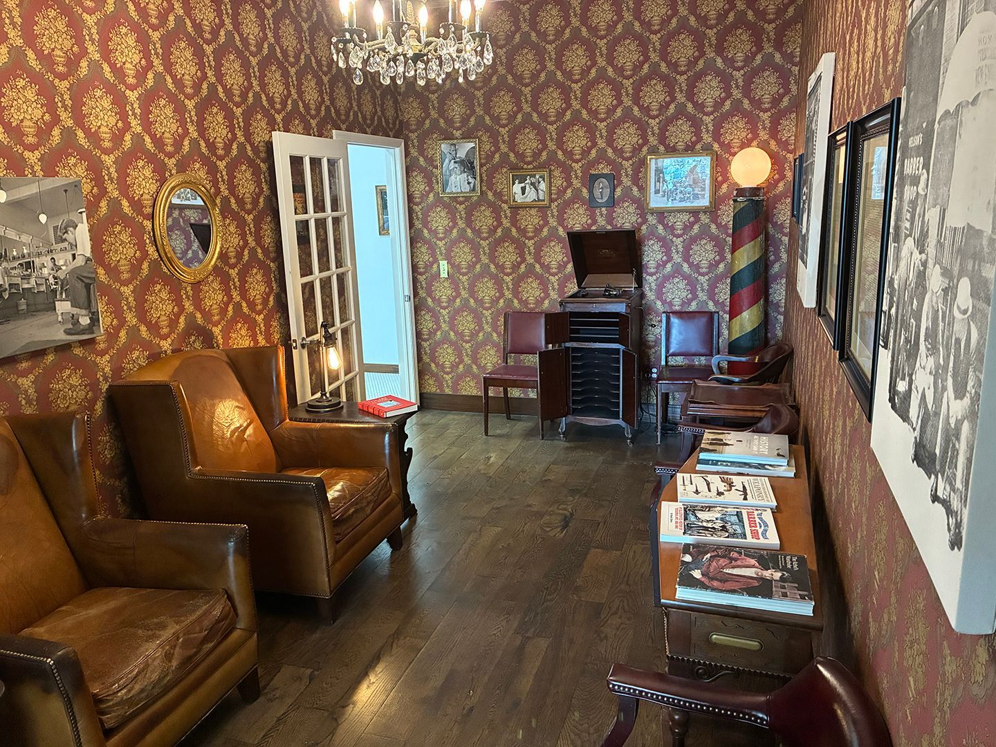 Comfortable barbershop waiting room with traditional barber chairs and vintage styling at Swagger & Blade in Monmouth County, NJ.