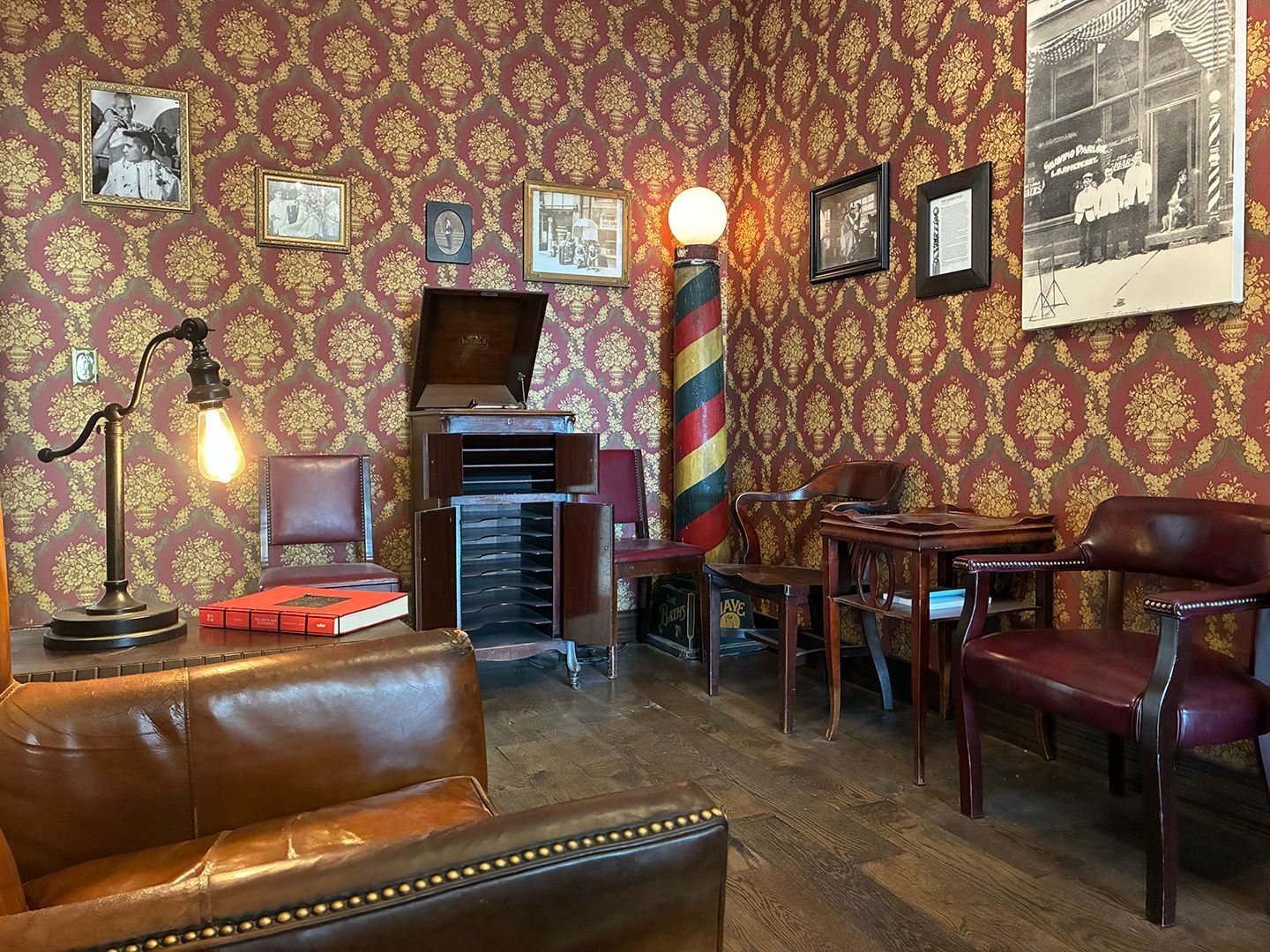 Classic barber lounge and waiting area with vintage barbershop decor at Swagger & Blade in Monmouth County, New Jersey.