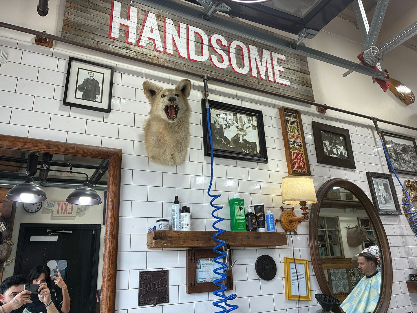 Vintage barbershop interior featuring classic decor and grooming stations at Swagger & Blade in Monmouth County, NJ.