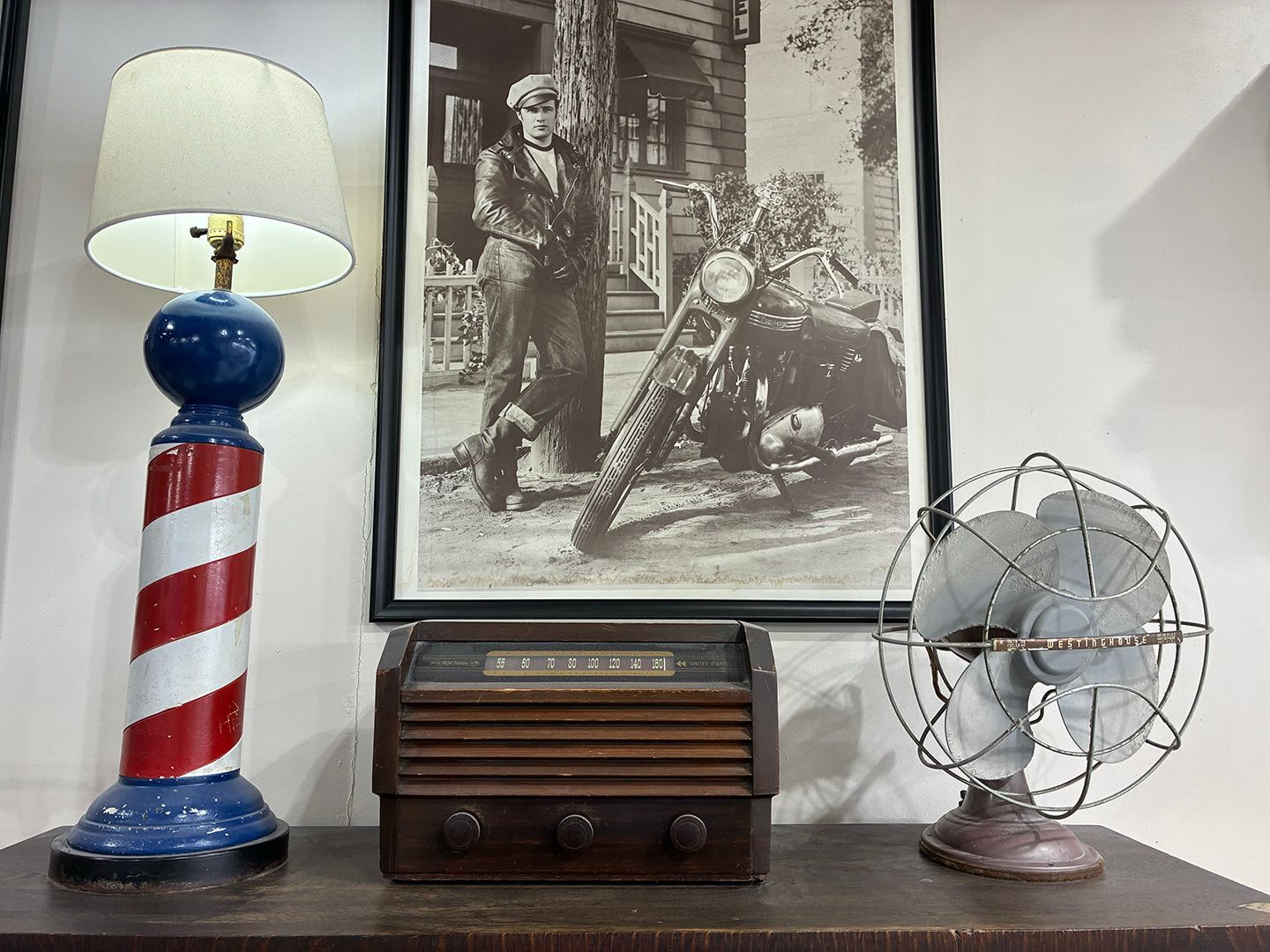 Vintage barbershop decor and classic barber pole display inside Swagger & Blade in Monmouth County, NJ.