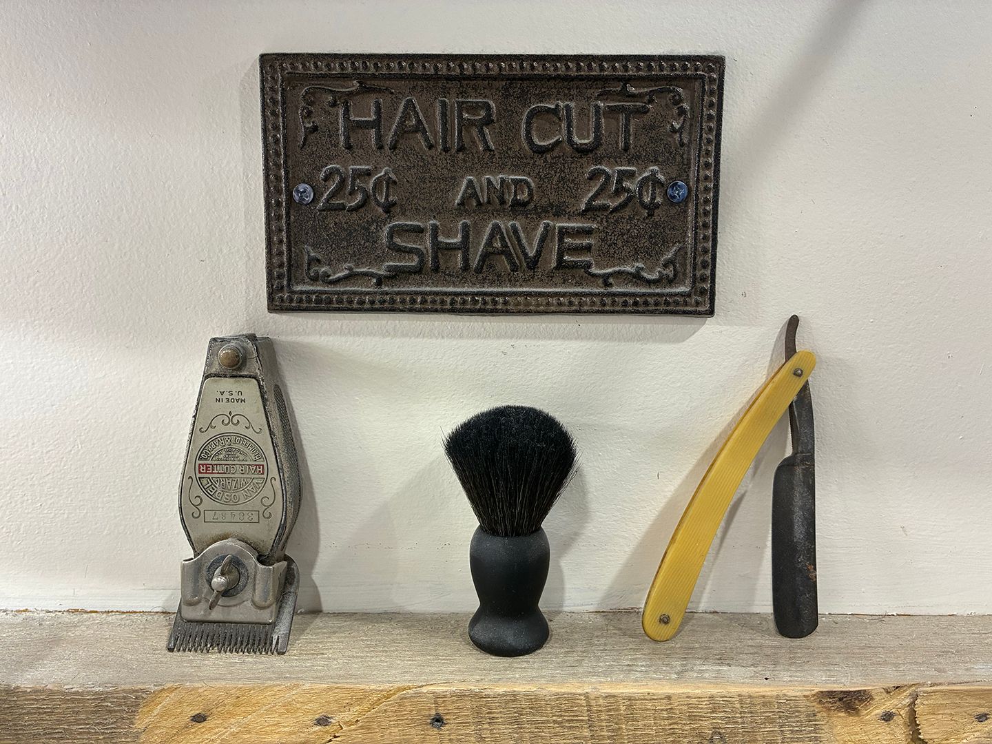 Traditional barbering memorabilia and grooming tools displayed inside Swagger & Blade barbershop in Monmouth County, NJ.