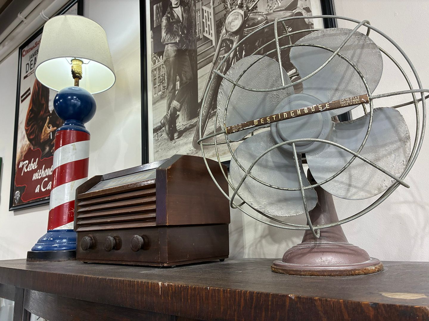 Vintage barber pole, antique fan, and classic barbershop decor at Swagger & Blade in Monmouth County, New Jersey.