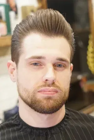 Classic men's pompadour haircut styled by the barbers at Swagger & Blade in Monmouth County, NJ.
