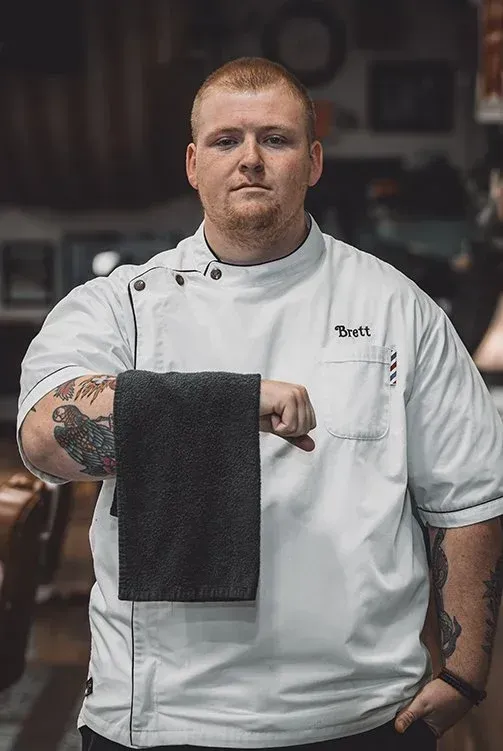 Brett Baxter, barber at Swagger & Blade providing men's haircuts, fades, beard trims, and grooming services in Monmouth County, NJ.