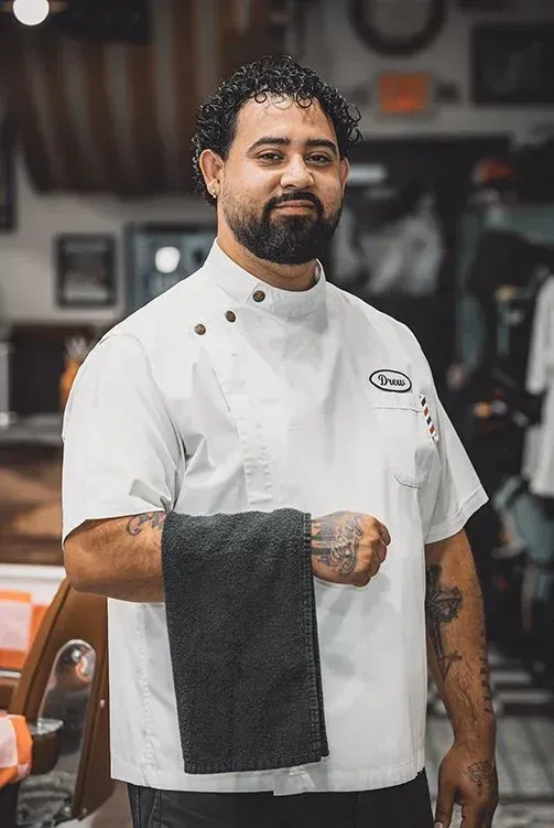 Drew Ruiz, professional barber at Swagger & Blade specializing in men's haircuts, fades, and beard grooming in Monmouth County, NJ.