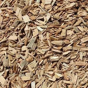 Pile of light brown wood chips.