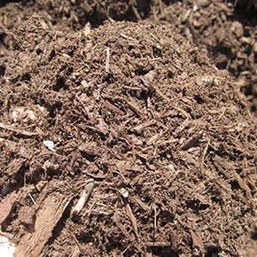 Pile of dark brown mulch.
