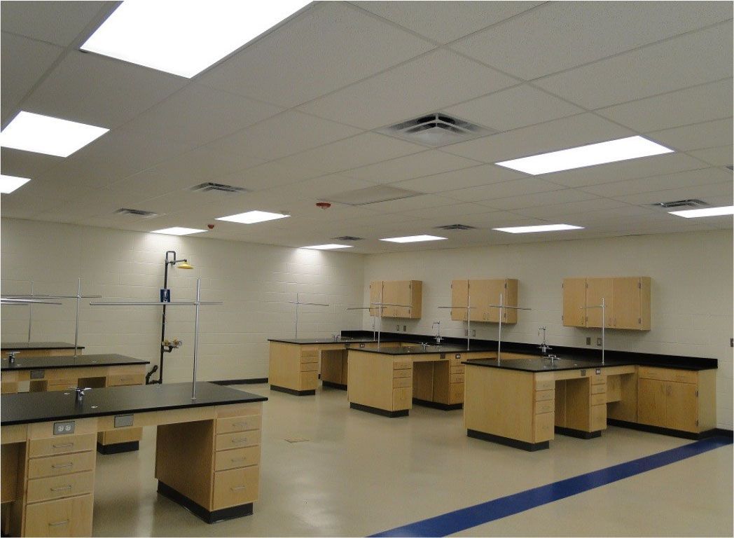 A lab with a lot of tables and cabinets
