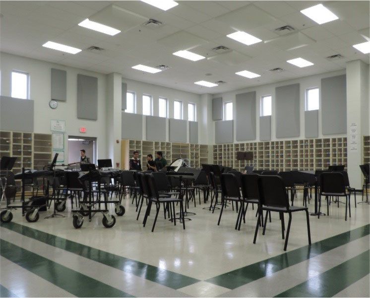 A large room with tables and chairs in it