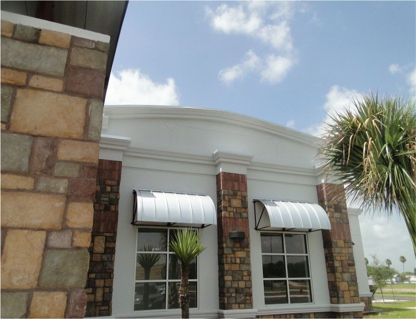 A building with a palm tree in front of it