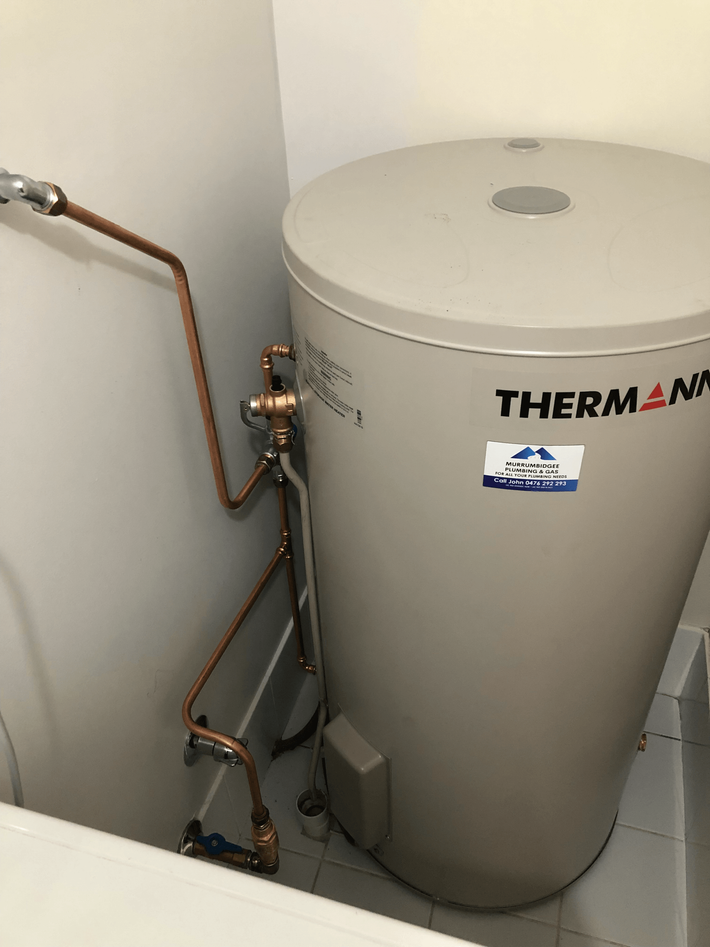 Plumber Servicing a Hot Water System