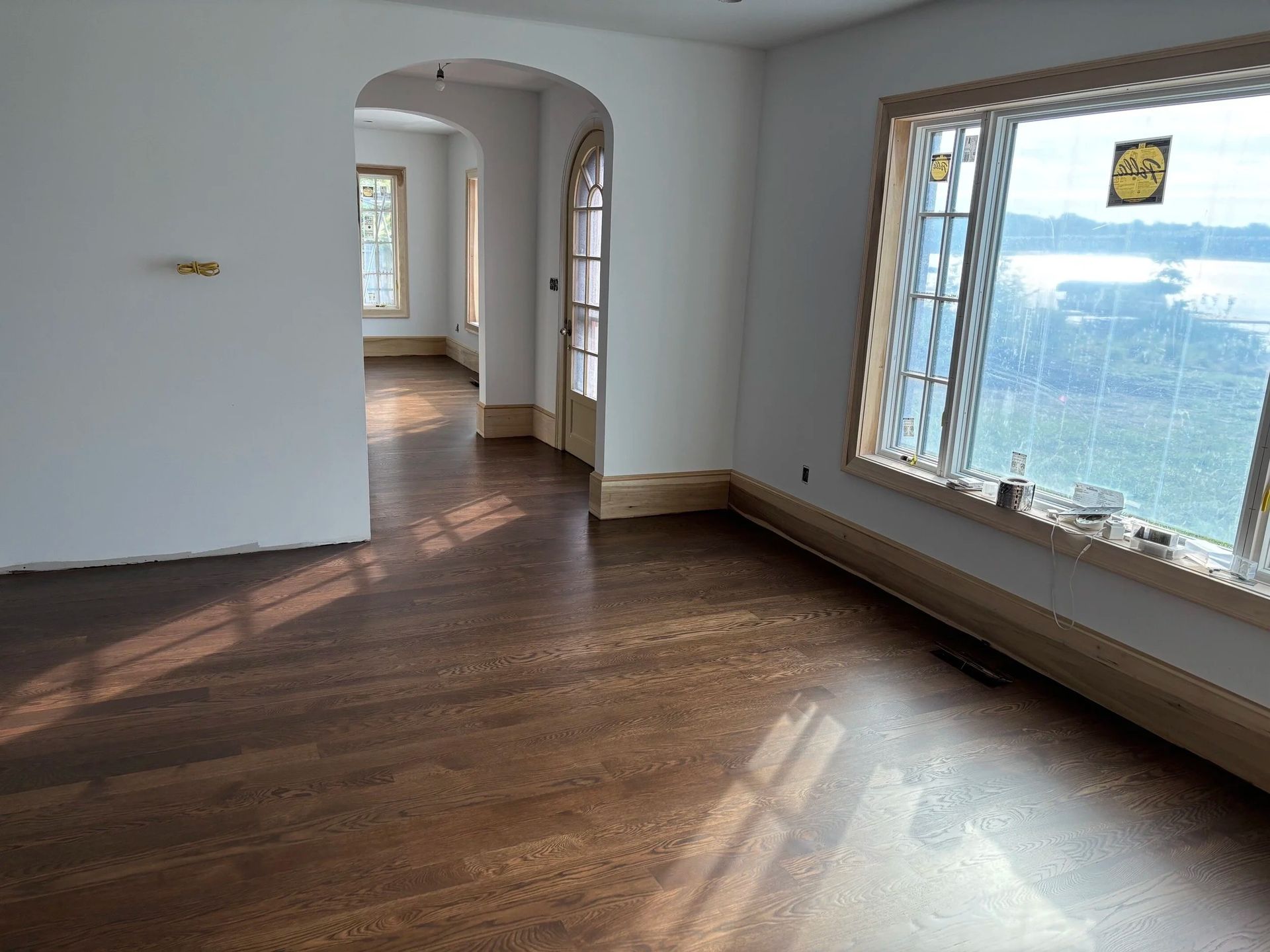 Built-in wooden entryway bench and storage cabinets in a carpeted hallway