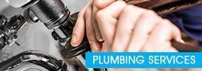 Plumber Working on Pipes