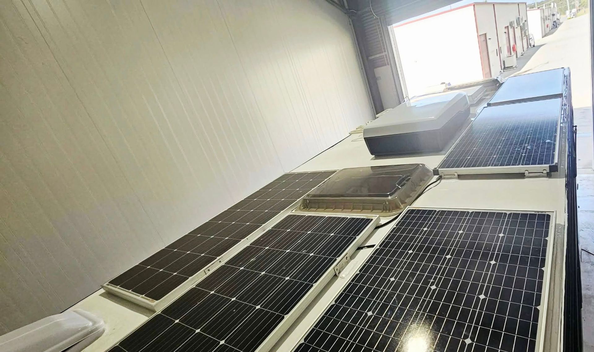 Solar Panels Mounted on the White Roof of a Recreational Vehicle — Coast to Country Caravan Repairs In Port Macquarie, NSW