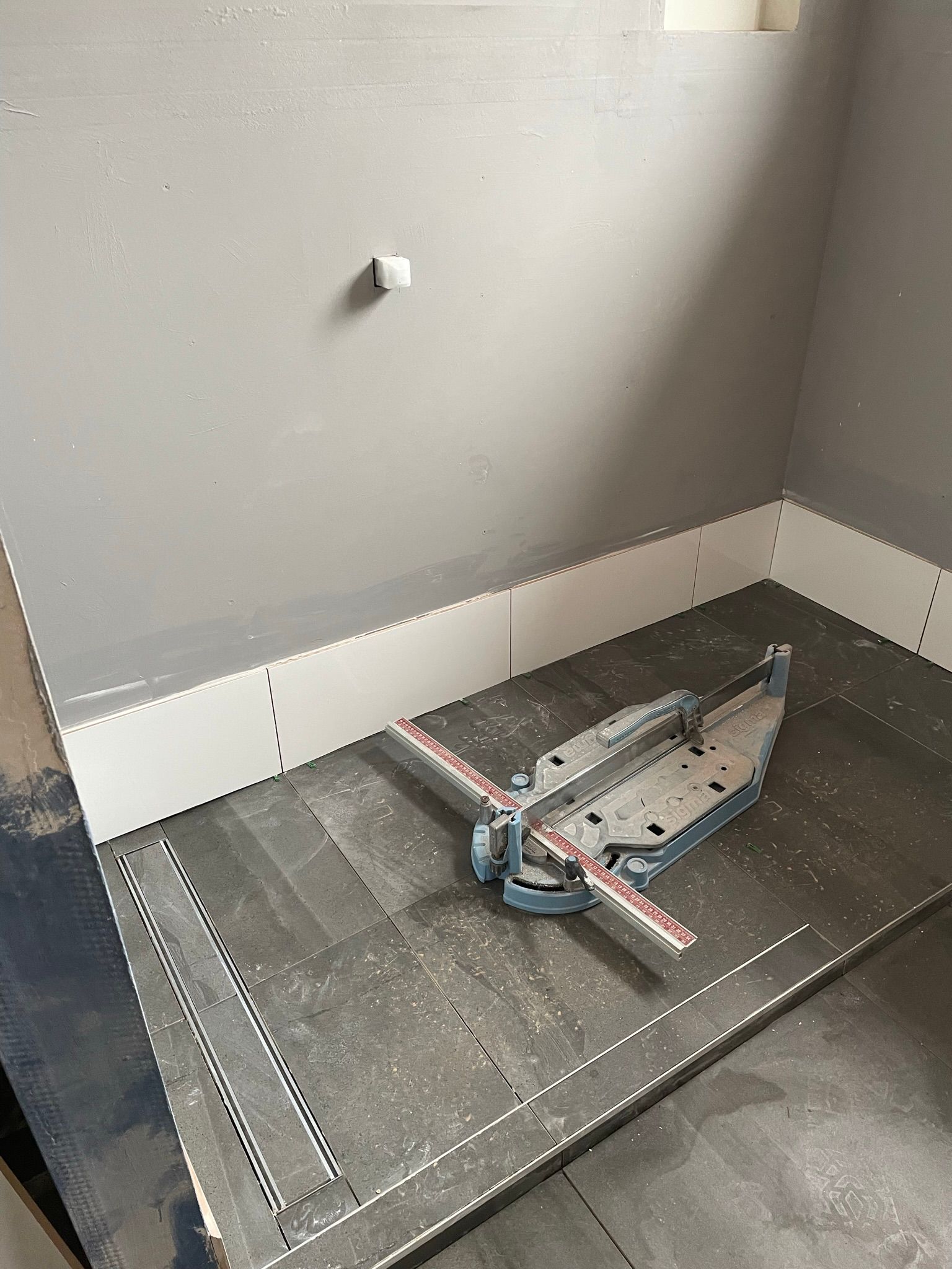 Construction floor with a tiled shower base, wall board, and plumbing fixture installation in progress — Taylormade Constructions & Renovations In Kingaroy, QLD