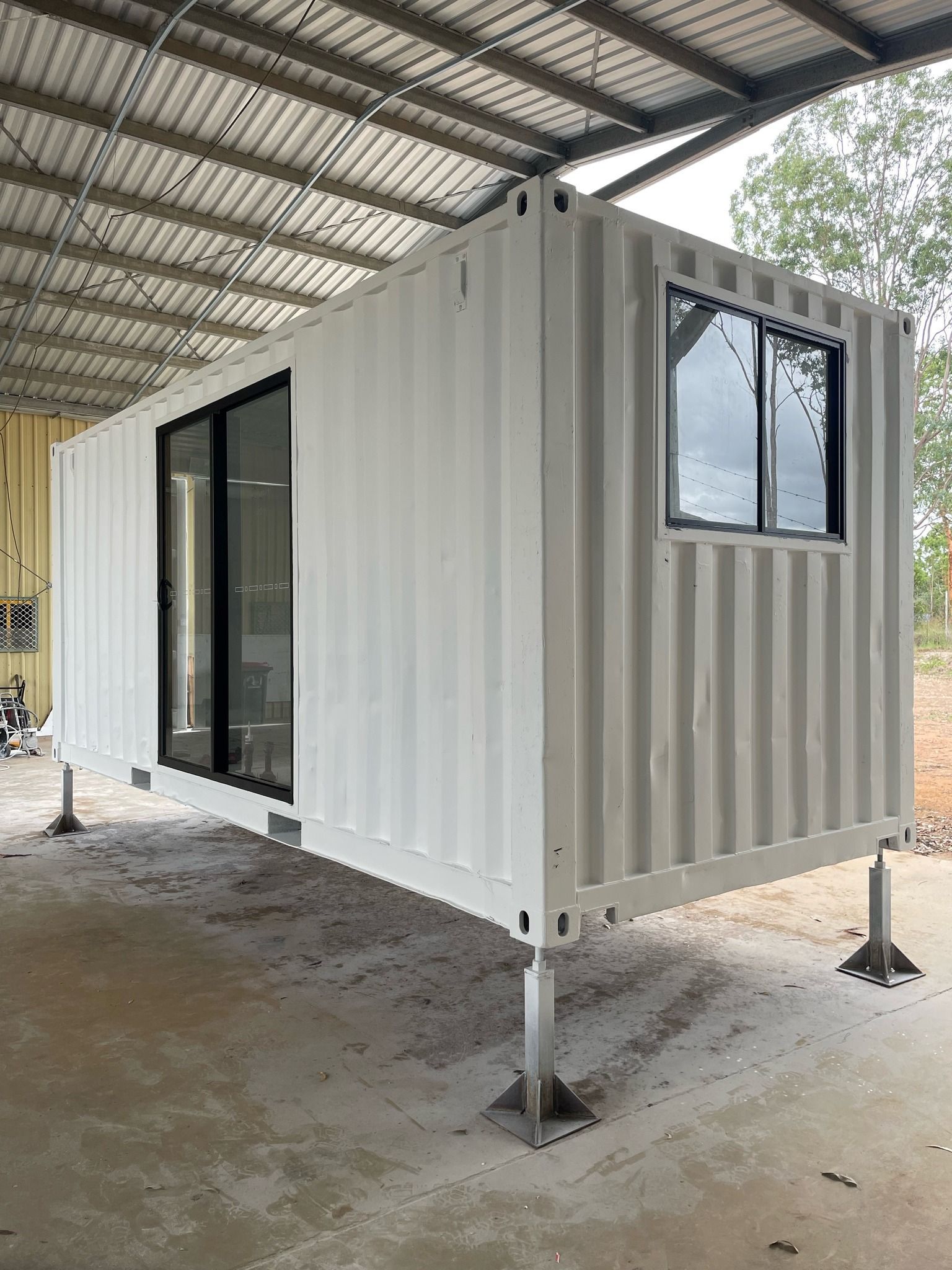 White Shipping Container Home With Large Windows — Taylormade Constructions & Renovations In Kingaroy, QLD