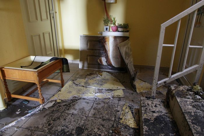 A room with stairs and a table in it
