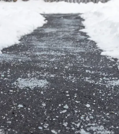 Commercial salting and ice management services to keep parking lots and walkways safe in winter