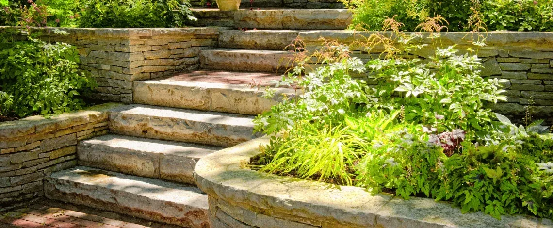 Signs Your Yard Needs a Retaining Wall: Natural Stone vs. Block