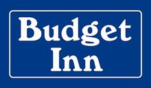 A blue sign that says budget inn on it