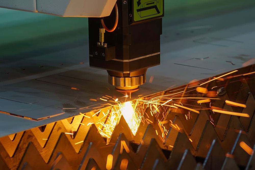 A Machine is Cutting a Piece of Metal With Sparks Coming Out of It — FVS Airconditioning & Electrical Pty Ltd in Ryan, QLD