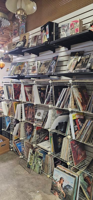 Store shelves filled with assorted magazines and comic books in colorful racks