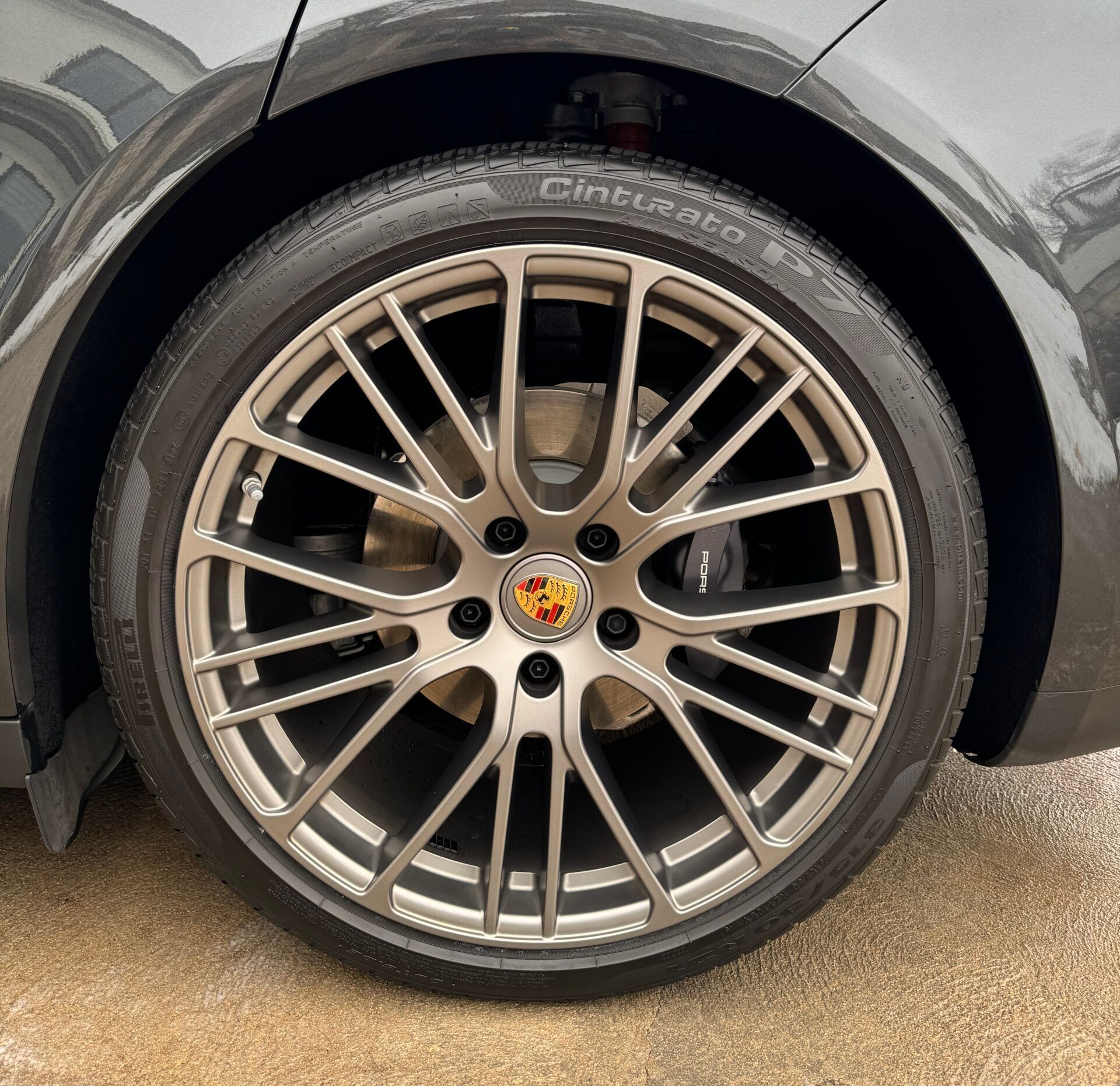 A close up of a car wheel with a tire on it
