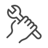 Hand holding a wrench, ready for repair or maintenance work.