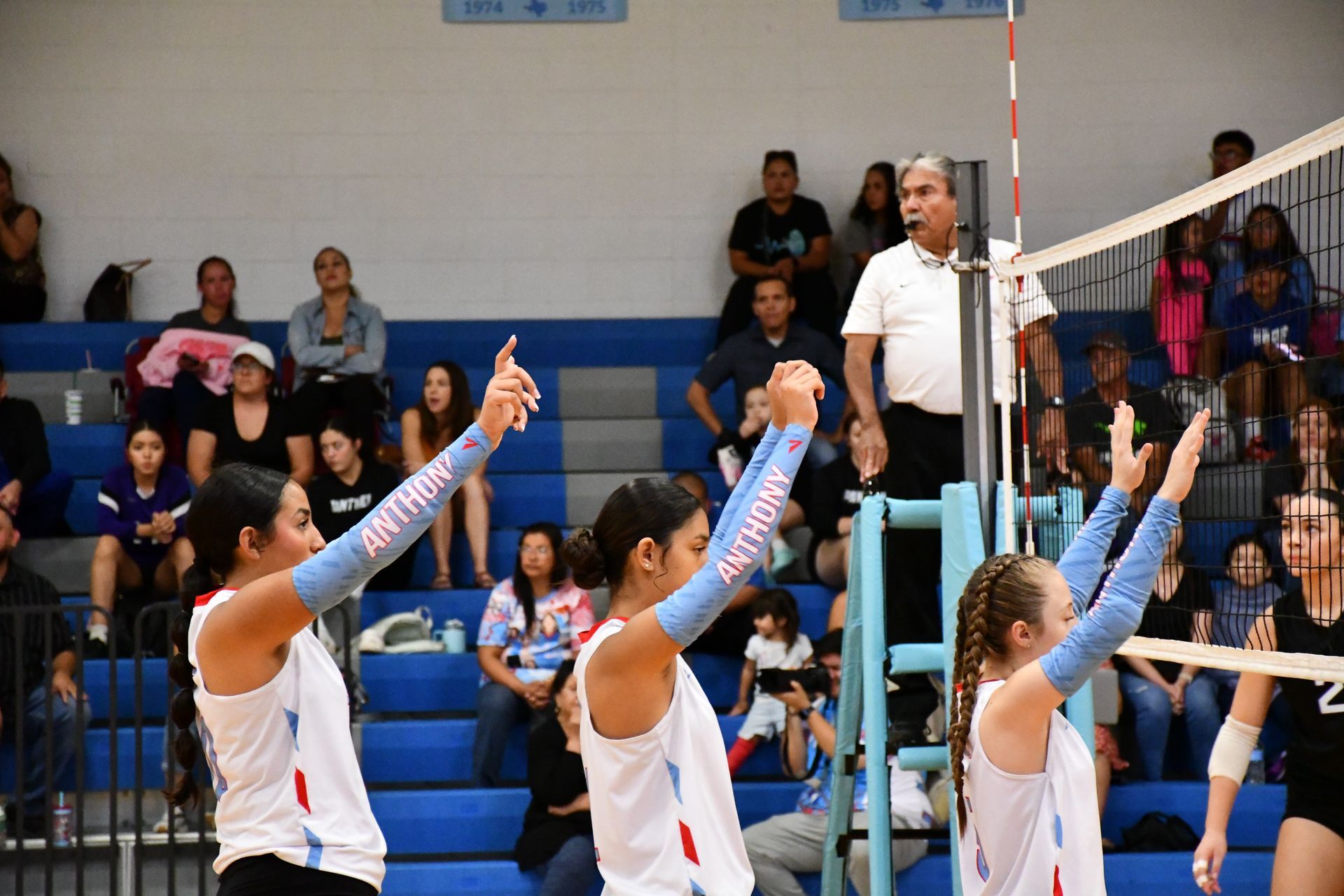 Volleyball players raise their hands