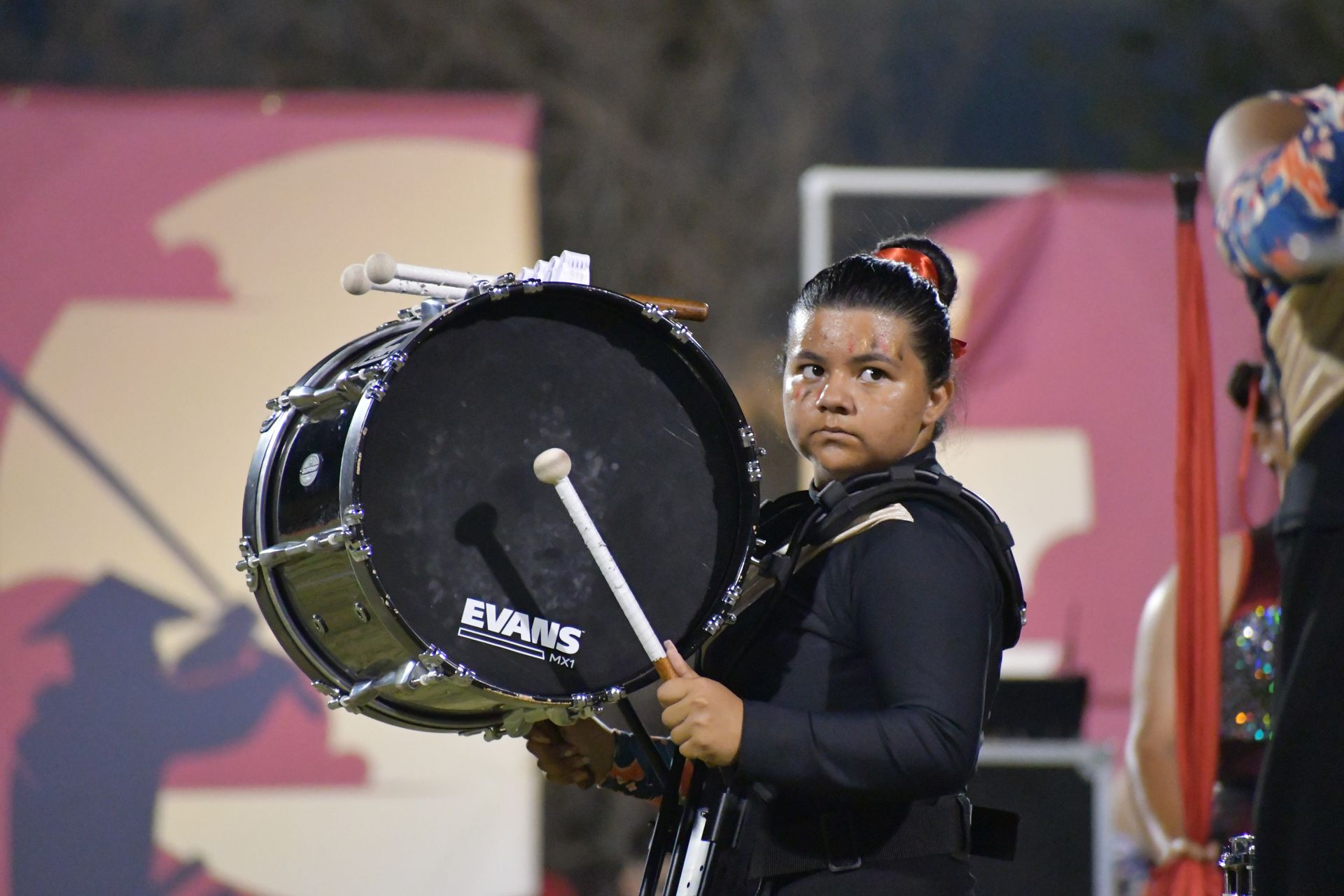 Female band student plays drum