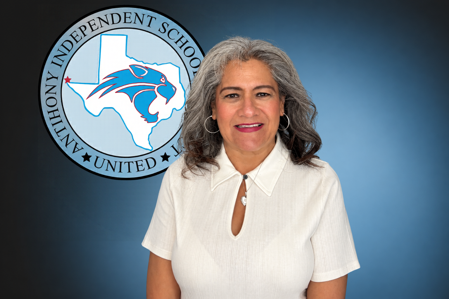 A woman is smiling in front of a logo for anthony independent school