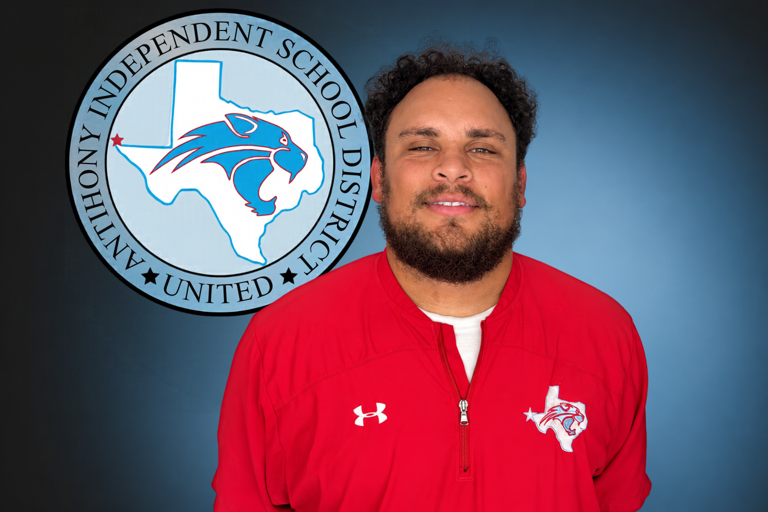 A man with a beard is standing in front of an independent school logo