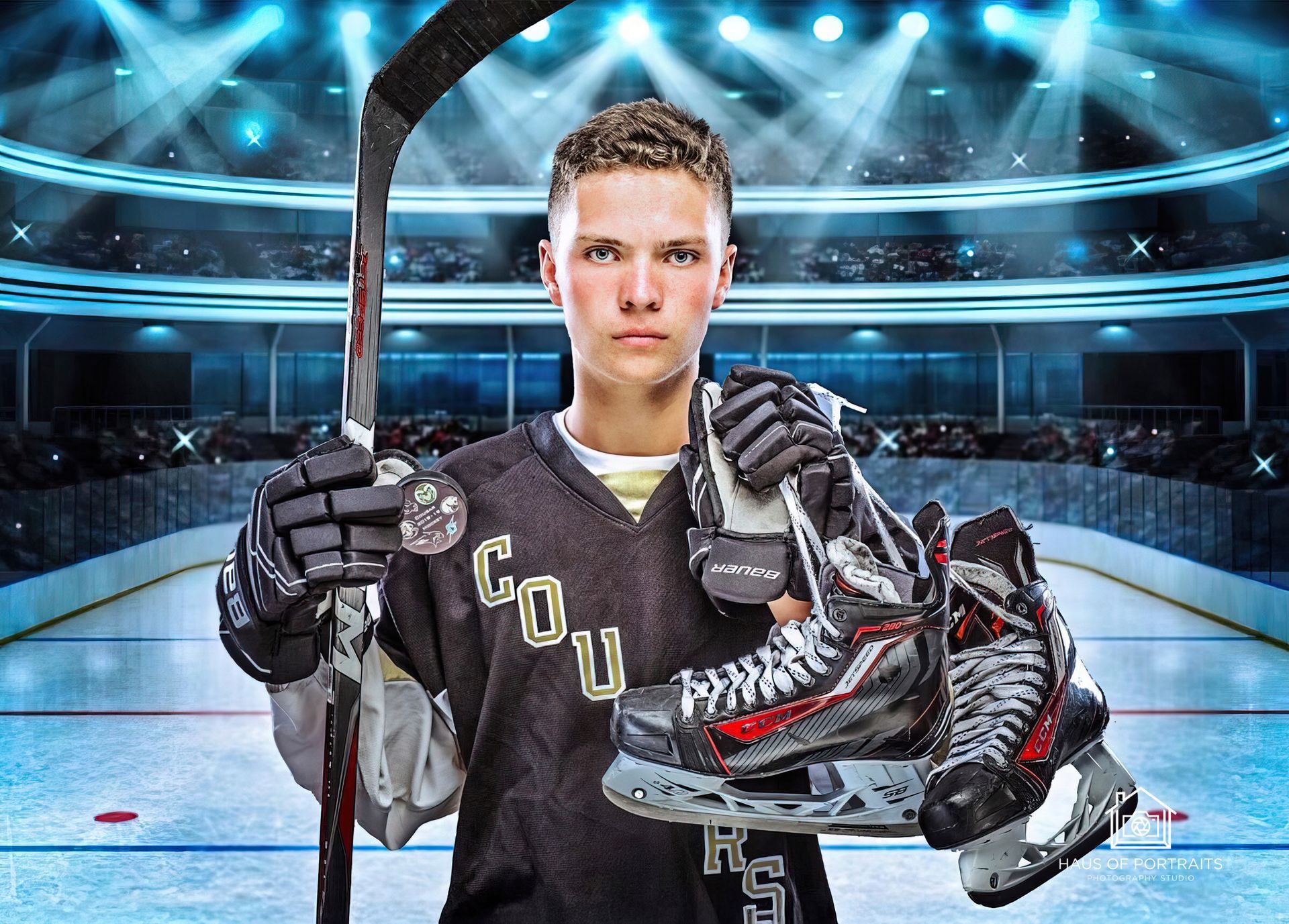 Hockey player in black uniform holding stick and skates on an ice rink under bright arena lights