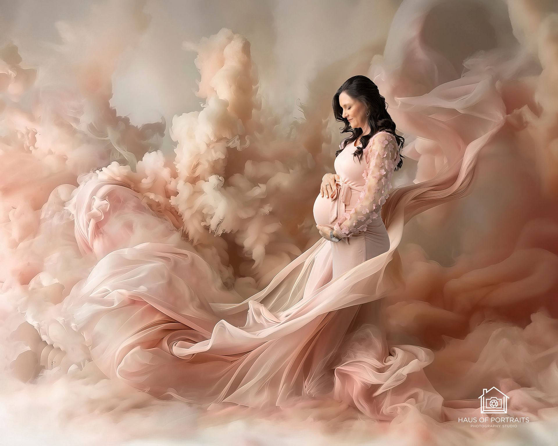 Woman in a flowing pink dress amid soft pastel clouds, posing in a dreamy, ethereal scene.