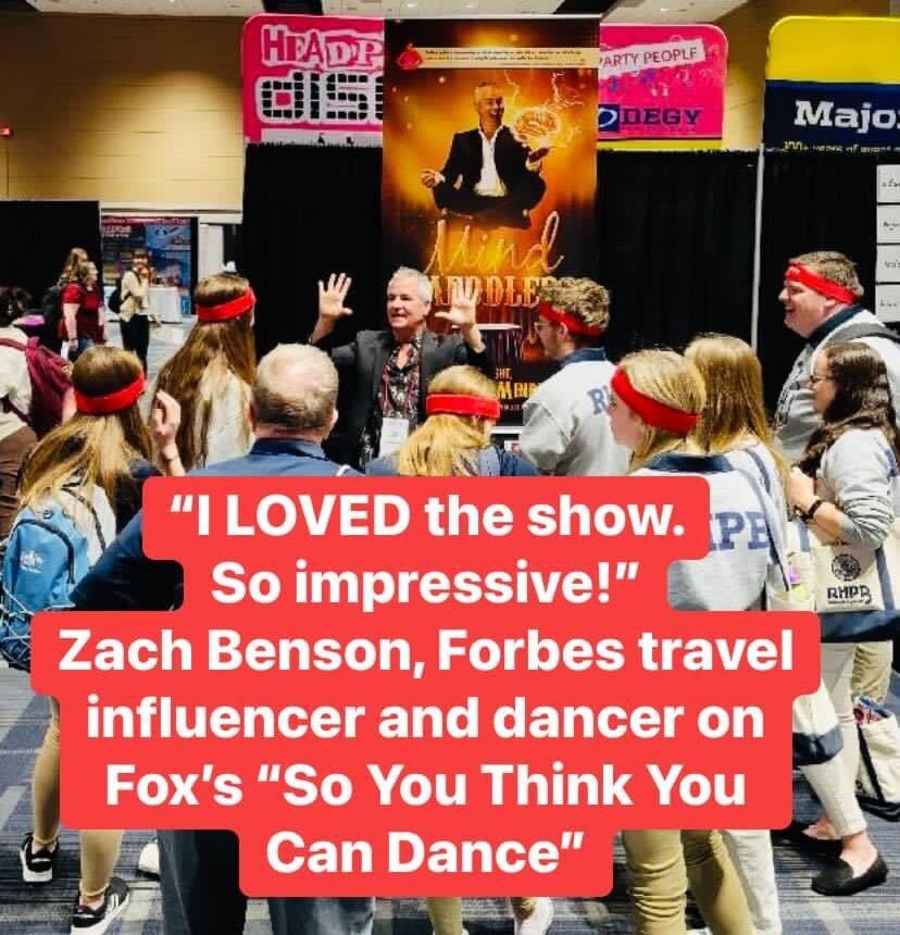 A group of people standing in front of a sign that says 