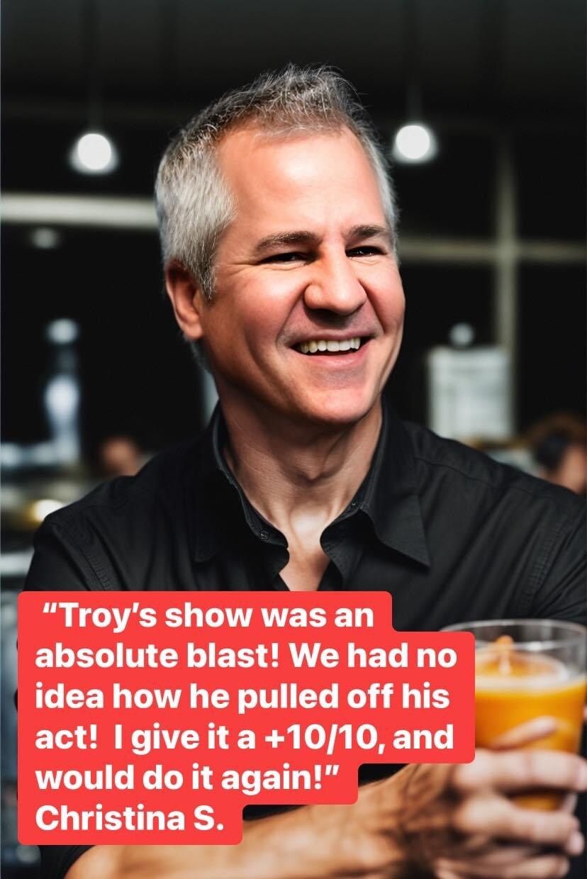 A man is smiling and holding a glass of orange juice