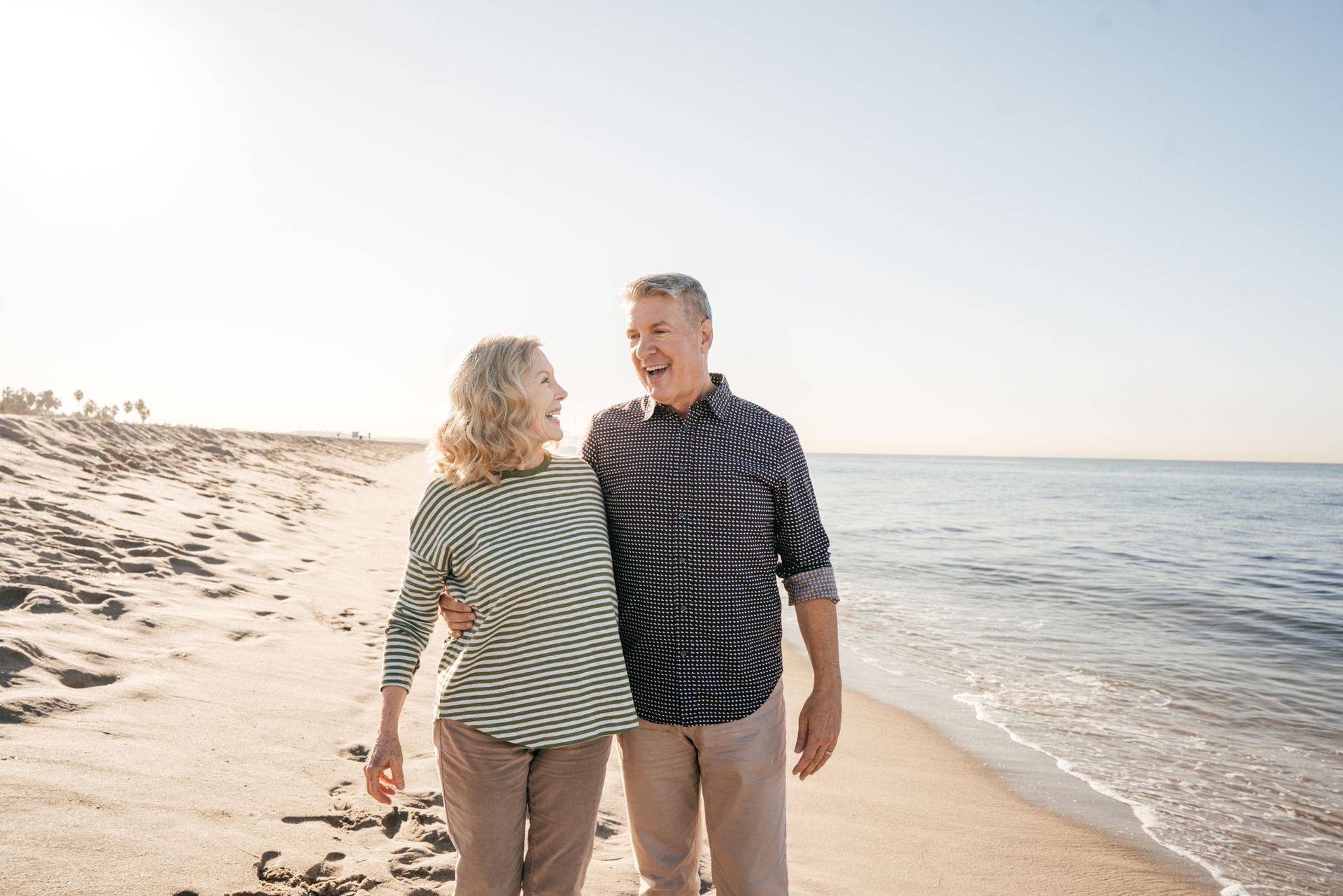 Married Couple Laughing While At The Beach - Richmond, VA - Eye Care Center of Virginia Married Couple Laughing While At The Beach - Richmond, VA - Eye Care Center of Virginia