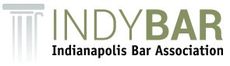 Logo for IndyBar: Indianapolis Bar Association, with a column design and green text.