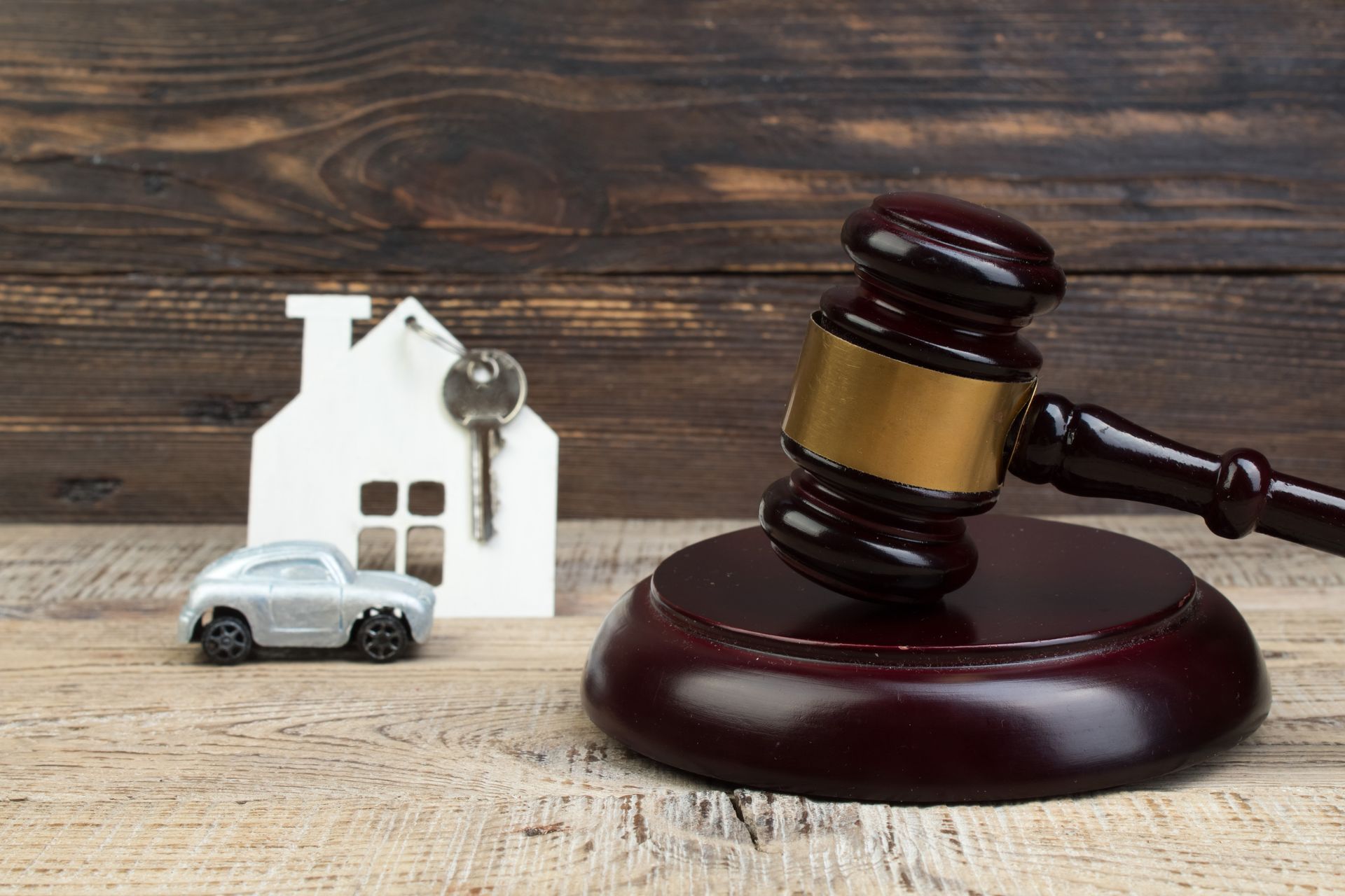 Bankruptcy concept for house and car with judge hammer