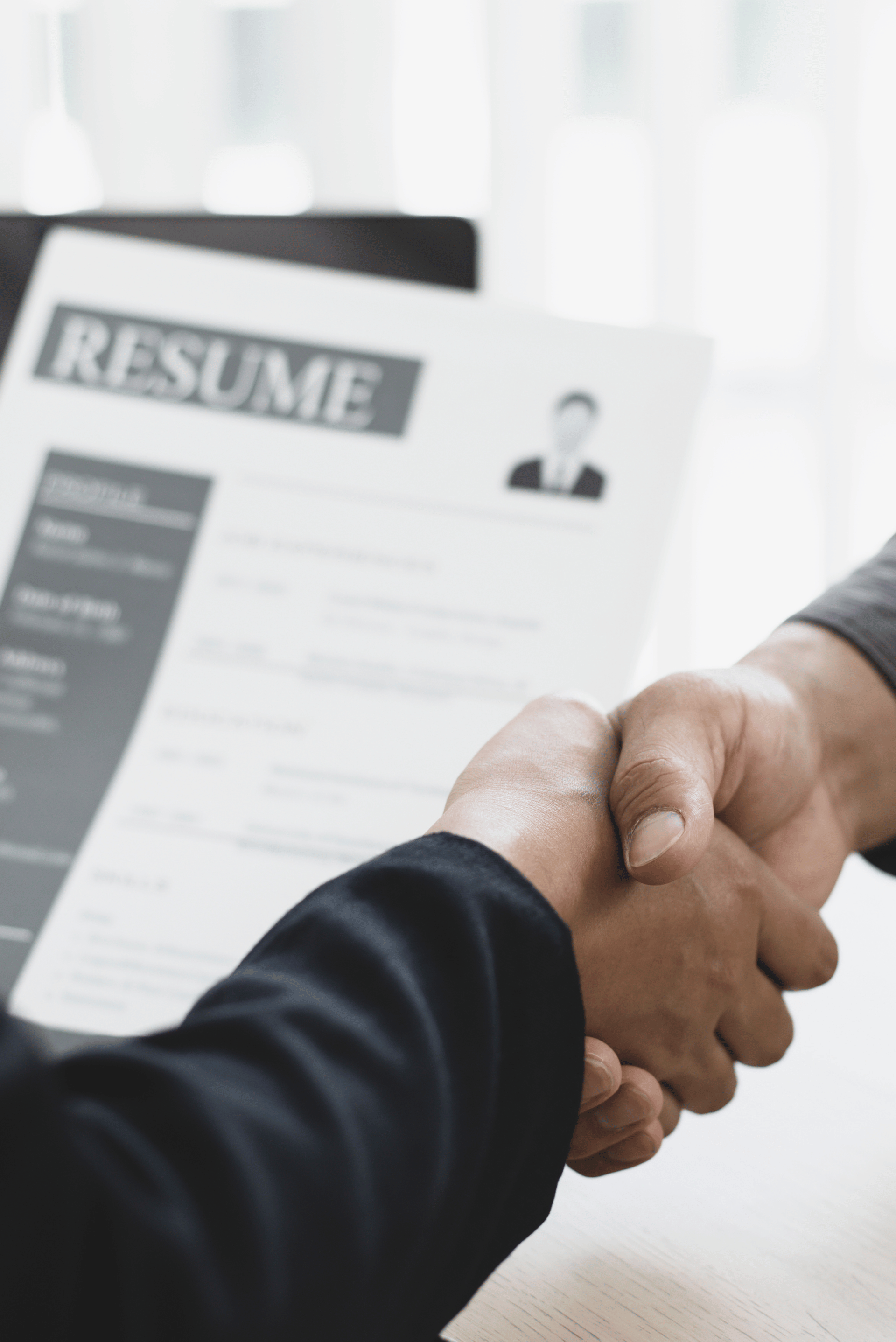 Handshake over resume during a job interview