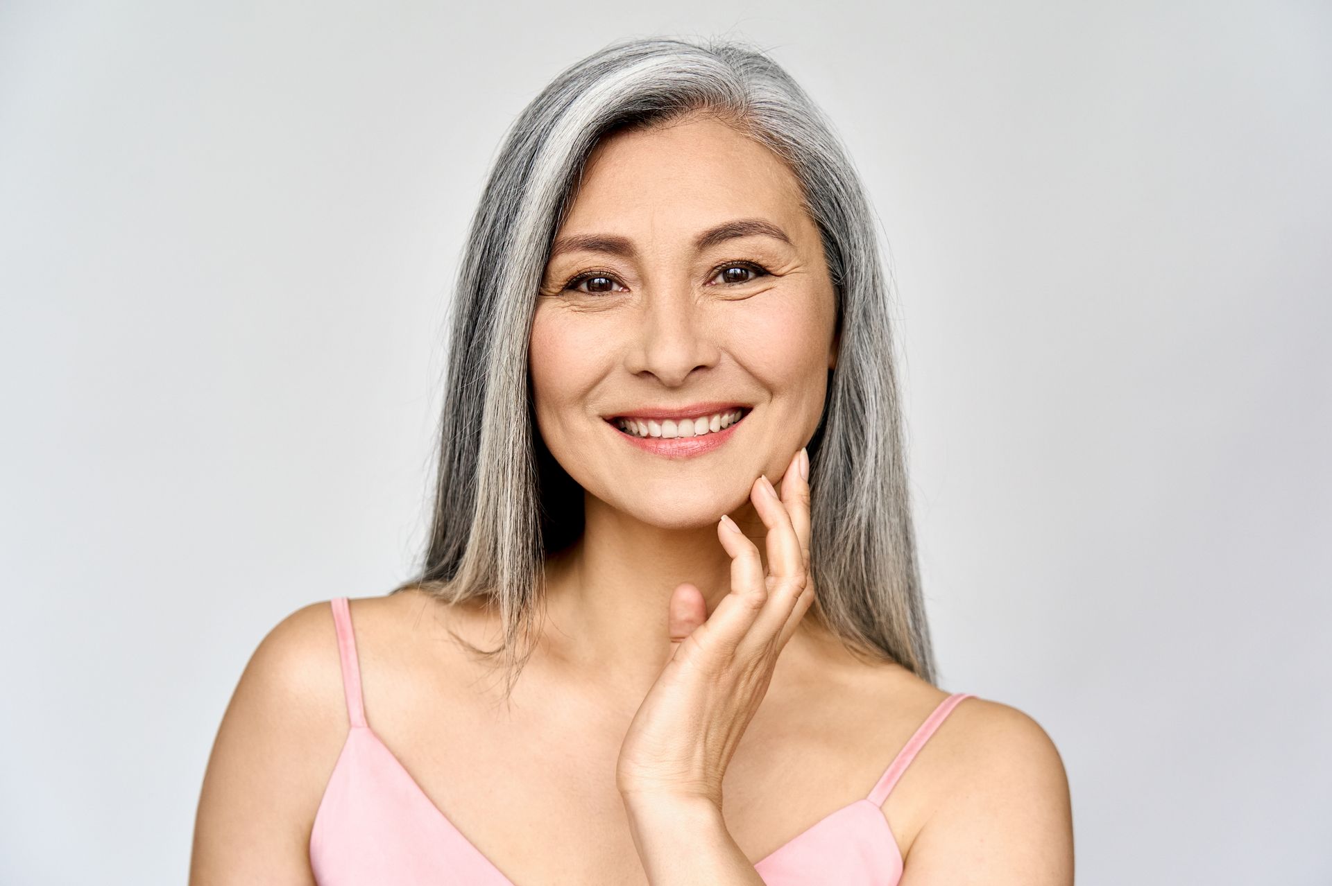 A woman is getting a botox injection in her face.