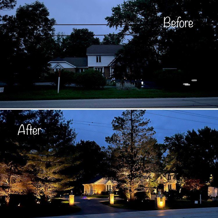 Illuminated brick residence showing a landscape lighting transformation
