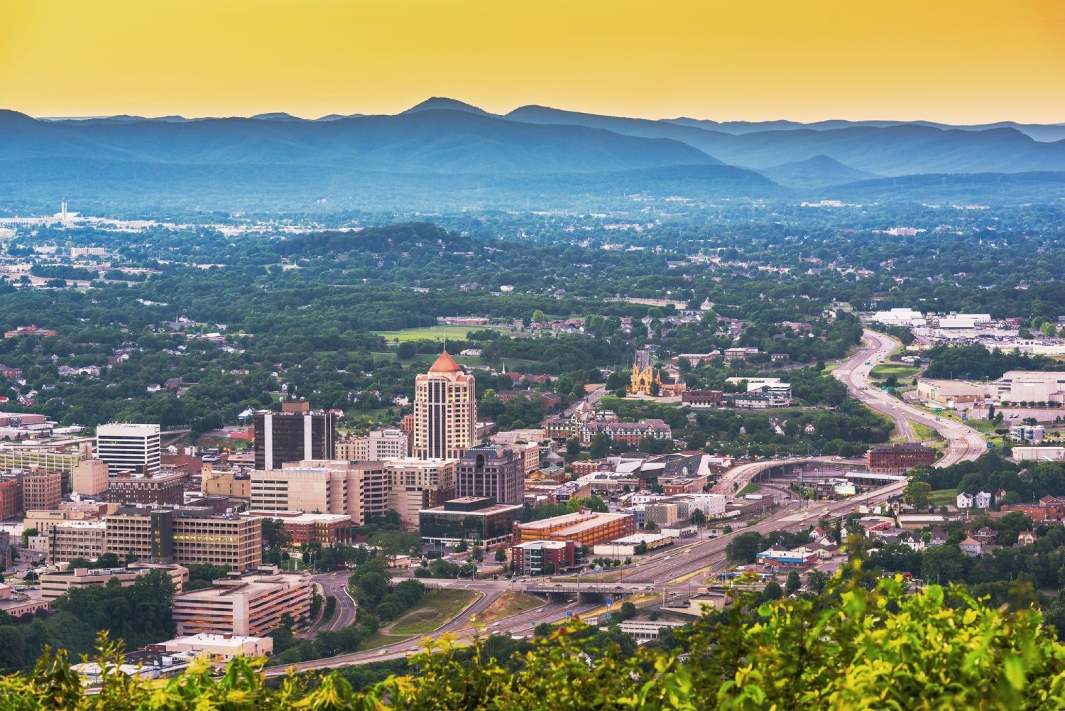 Roanoke, Virginia, USA downtown skyline from above at dusk.