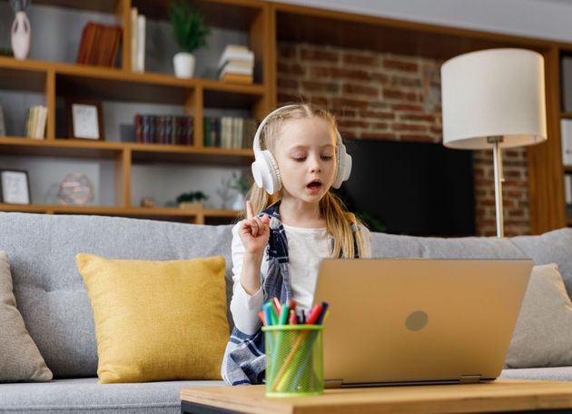 Young girl using a laptop.