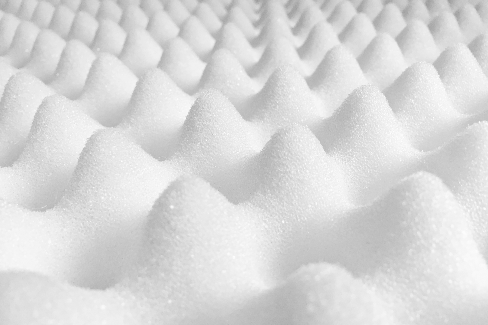 White foam or snow-like peaks forming a repeating textured pattern