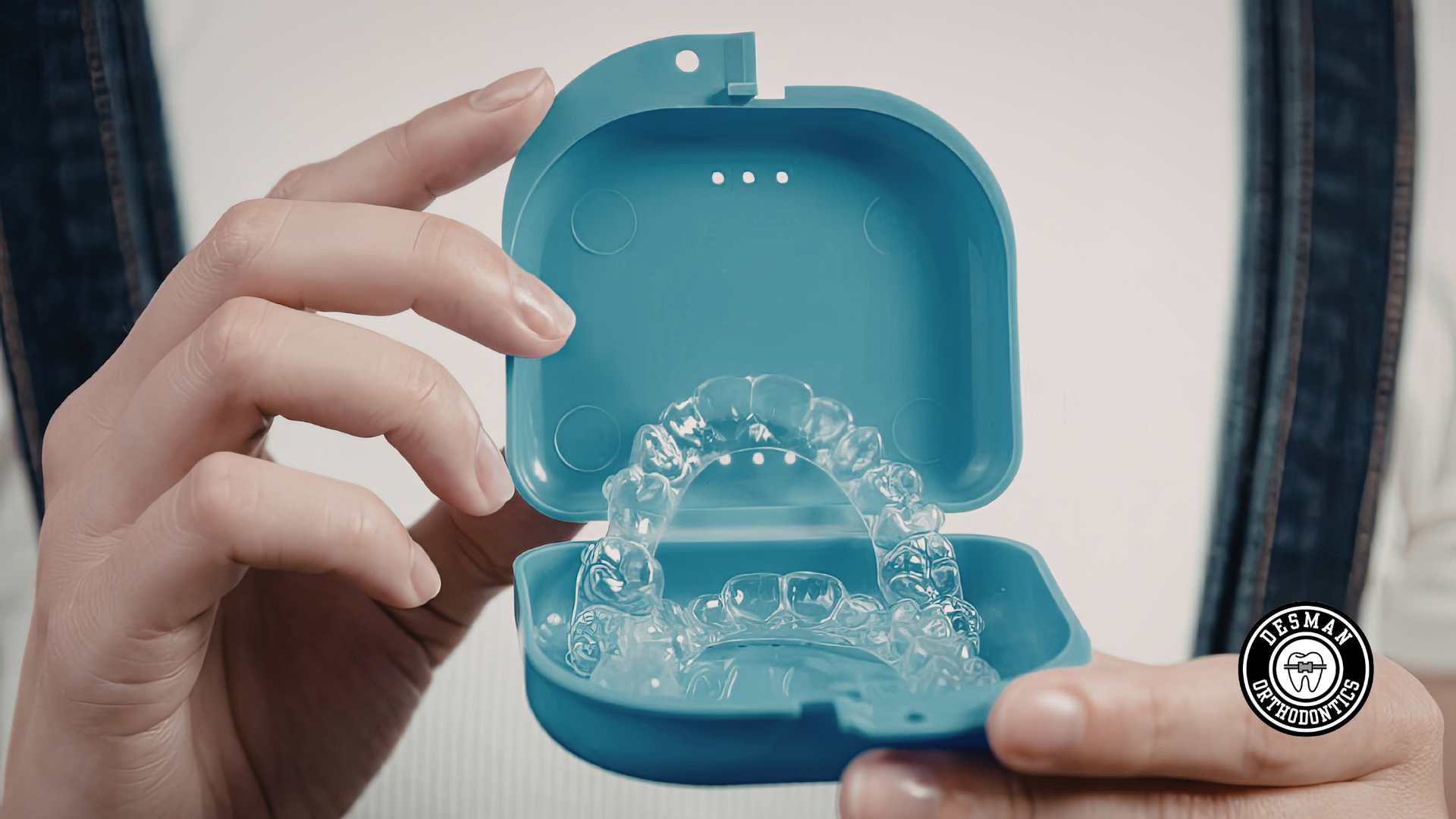 Dentist using tools to work on a patient’s open mouth during a dental procedure