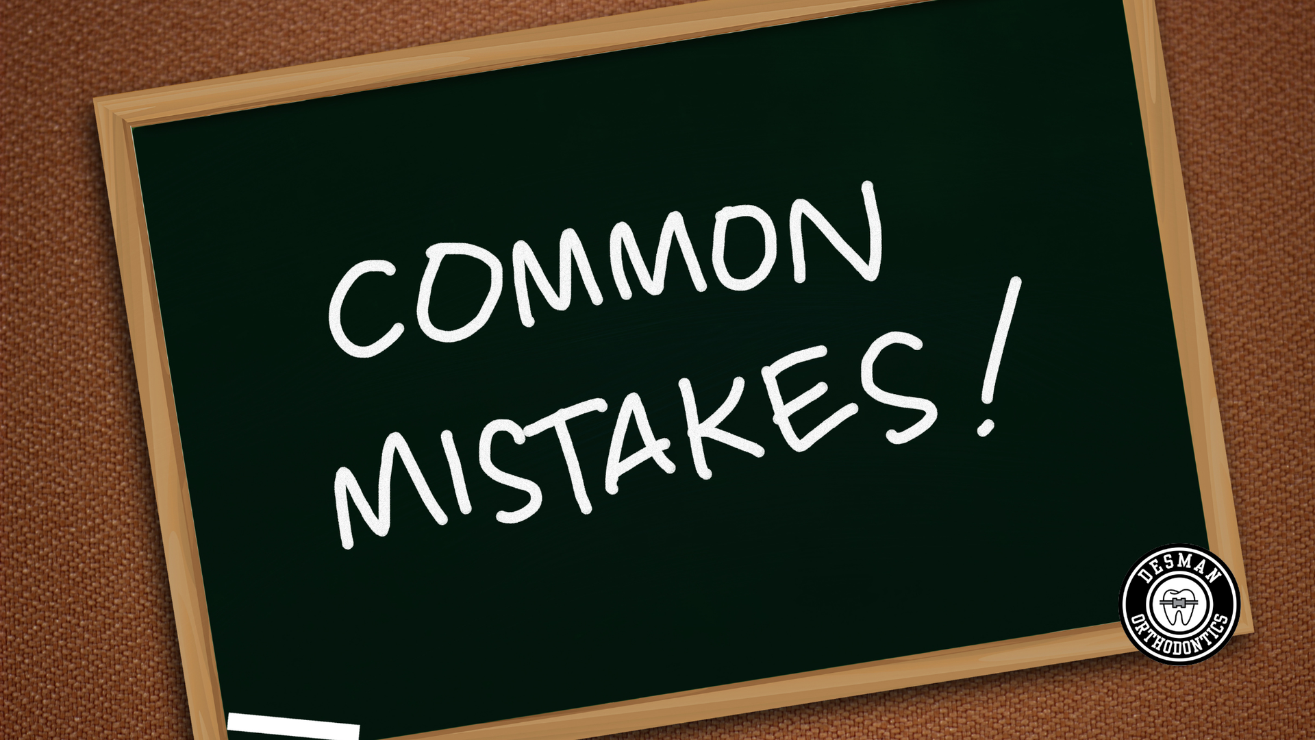 Chalkboard with the words “COMMON MISTAKES!” in white chalk on a wooden background.