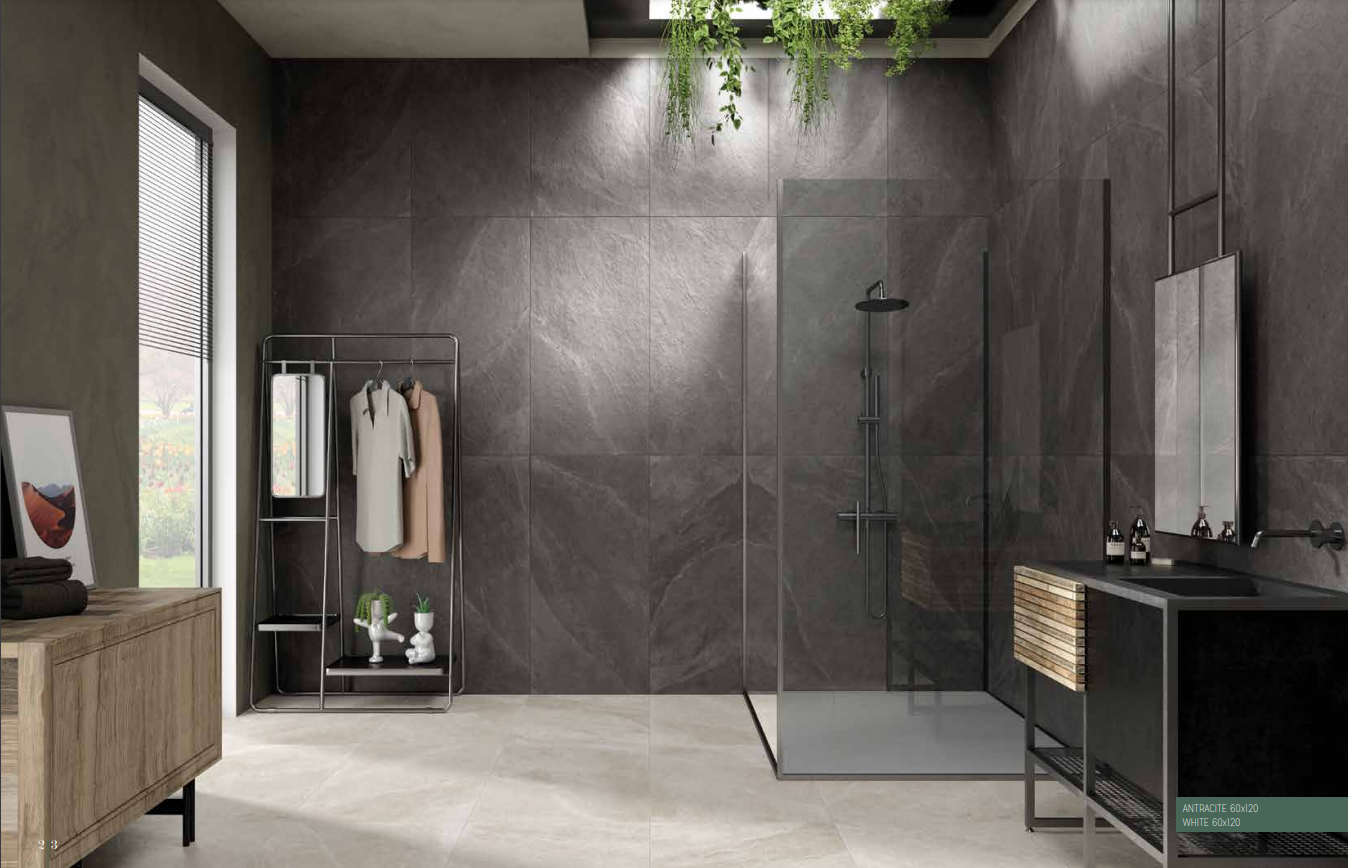 Bagno moderno di colore grigio con cabina doccia, mobile lavabo e appendiabiti vicino a una finestra.